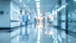 © ShahinAlam - Blurred hospital corridor with medical staff walking