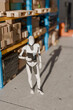 © Rendara Studio - 3D Robot Inventory Tablet, warehouse aisle checks boxed stock