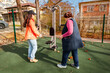 © _KUBE_ - Senior Caucasian woman exercises outdoors with a fitness trainer during recovery after illness. Sport supports rehabilitation, strength, and active aging.