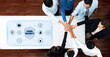 © InfiniteFlow - Dynamic group of professionals collaborating on cyber security strategies, showcasing hands joined in unity above a modern office table with protection symbols. Trope