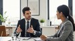© SHAPLA - Professional discussion between two businesspeople in a modern office setting