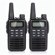 © dark knight - Two identical black walkie-talkies with antennas and digital displays.