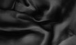 © Julia - Luxury silk satin fabric background. Fashion elegant dark shade of white, grey and black. Smooth monochrome surface. Waves on the crumbled material. Abstract folds with shine. Dark smoke iron, jet