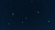 © sablengjago - Dark night sky with numerous stars and streaks of light, possibly shooting stars