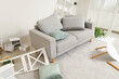 © Pixel-Shot - Sofa with overturned things in messy living room