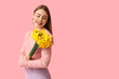 © Pixel-Shot - Happy young woman with bouquet of beautiful daffodil flowers on pink background