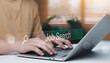 © ภัทรชัย รัตนชัยวงค์ - Job search concept with hands typing on laptop and virtual search bar interface. Online career application, recruitment technology, remote work and employment opportunity background.