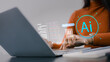 © Thawatchai Images - Close up of woman using laptop with AI generative technology interface. Content creator typing command prompts to generate digital art and text using artificial intelligence in modern office.