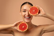© Home-stock - Health portrait and happy woman with grapefruit for fruit detox, healthcare or natural facial skincare routine. Vitamin c food product