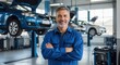 © Farhan - Portrait of a Senior Professional Mechanic with Arms Crossed in a Modern Auto Repair Shop