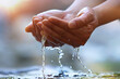 © artpluskr - Precious water of life, World Water Day background, drink clear, clean water in your hand.