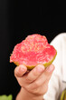 © TranVan - Fresh Ripe Red Guava Fruit from Guangxi China Held in Hand Showing Pink Flesh and Seeds