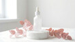 © azen - Serene white bottle with dropper on marble podium surrounded by delicate pink petals in soft natural light