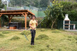 © Alvaro Lavin/Stocksy - Man smiling while working in his garden.