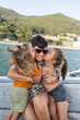 © Alvaro Lavin/Stocksy - Happy family enjoying boat trip on summer vacation