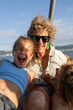 © Alvaro Lavin/Stocksy - Happy family having fun enjoying boat trip during summer vacation