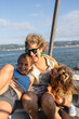 © Alvaro Lavin/Stocksy - Happy family having fun and enjoying boat trip on summer vacation