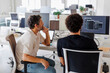 © BONNINSTUDIO/Stocksy - Software developers team working on project using computer in office