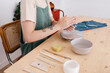 © Tania Cervian/Stocksy - Craftswoman pressing clay with hands