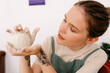 © Tania Cervian/Stocksy - Woman touching rim of clay bowl