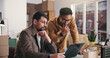 © WesJVR/peopleimages.com - Logistics, review or team in office with laptop, order track or inventory management for shipping. Collaboration, men or suppliers with tech, stock control or delivery update in supply chain.