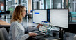 © Andrey Popov - Businesswoman Schedules Meetings And Emails On Digital Calendar