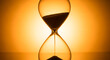 © md - An elegant hourglass with sand flowing against a vibrant orange background.