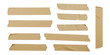 © GraphixEra - Collection of realistic brown masking tape strips and pieces, isolated on white background, versatile graphic design elements