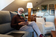 © Luis Velasco/Stocksy - Senior Man Relaxing With Smartphone at Home