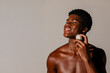 © Natalia Blauth/Stocksy - Joyful Skincare Routine with Microcurrent Device