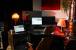 © Artem Podrez/Stocksy - Professional recording studio setup at night