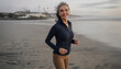 © Rob and Julia Campbell/Stocksy - Energized Woman Jogging Along Beach During Early Morning