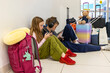 © Raymond Forbes LLC/Stocksy - Family Airport Travel on mobile phone