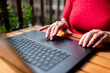 © Ibai Acevedo/Stocksy - Close up of senior hands using modern laptop