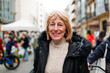 © Ibai Acevedo/Stocksy - Happy senior woman on flea market street