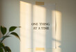 © Maksym - Motivational quote one thing at a time taped to wall