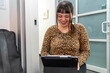 © Christine La/Stocksy - happy using tablet tech