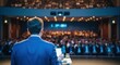 © Rhallyson - Speaker addressing audience at a business conference with presentation screen