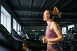 © DZ FILM/Stocksy - A woman on a treadmill in the gym