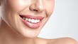 © Sulton - Radiant Smile: A close-up view of a woman's perfect smile, showcasing healthy, white teeth and a radiant, natural glow.
