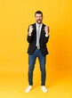© luismolinero - Full-length shot of business man over isolated yellow background frustrated by a bad situation