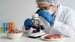 © Penelope - Scientist examining meat under microscope