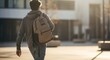 © Fajar - High school student wearing backpack walking outdoors in natural sunlight, candid lifestyle moment capturing modern education, youth independence, and back to school concept.