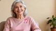 © saliayeung - Gentle Resilience – Elderly Survivor in Pink Ribbon Brooch for Breast Cancer Awareness Month