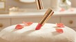 © flashmovie - Golden tube lipstick with a matte pink color appearing on a plush velvet stool, surrounded by delicate fresh rose petals, creating a soft and elegant beauty product display