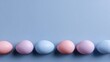 © Matcha_09 - Colorful pastel eggs arranged neatly on a soft blue background, perfect for spring celebrations, Easter decorations, and festive occasions