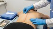 © Sabbir9003 - Medical professional examining a patient's back in a clinical setting
