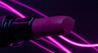 © MMVisualLab - Macro shot of purple lipstick tube against dark background with glowing pink neon light streaks creating dynamic motion and modern aesthetic design