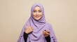 © Tapasma - Successful Muslim Woman with Thumbs Up and Dates