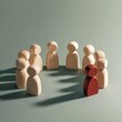 © maria_lh - A red wooden figure stands out from a crowd of others. Concept of leadership, individuality, and being different